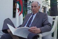 رفض سياسات النظام الجزائري بعد الاستقلال فحُكم عليه بالإعدام بتهمة التآمر على الدولة 

