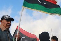 بعد قيام الثورة الليبية عام 2011 والإطاحة بحكم معمر القذافي حمل الشعب الليبي أعلام ليبيا التي كانت مستخدمة في عهد الملك السنوسي وليتم اعتمادها لاحقًا من جديد كعلم رسمي لليبيا 
