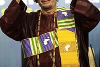 القذافي بالزي في إحدى المناسبات العالمية
