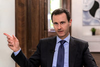 الابن الأوسط هو بشار الأسد والمولود عام 1965 وهو الرئيس التاسع عشر لسوريا والخامس في تاريخ الجمهورية العربية السورية وخلف والده في الحكم منذ عام 2000

